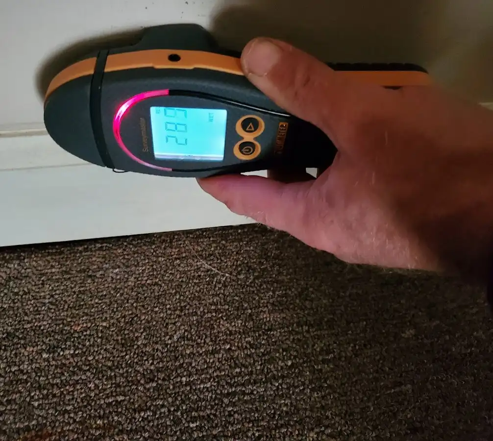 Moisture detection at baseboard during Storm Damage Restoration in Wawayanda